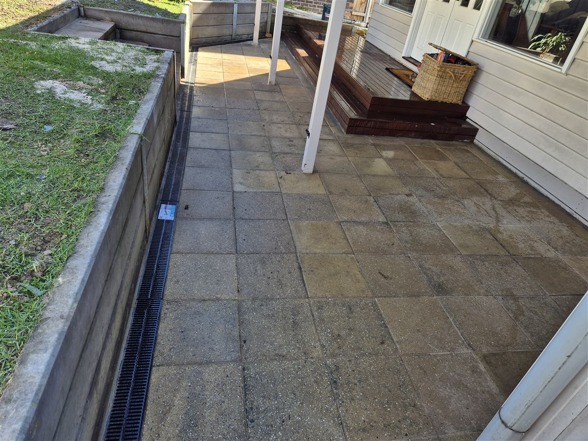 Paved courtyard with drainage channel