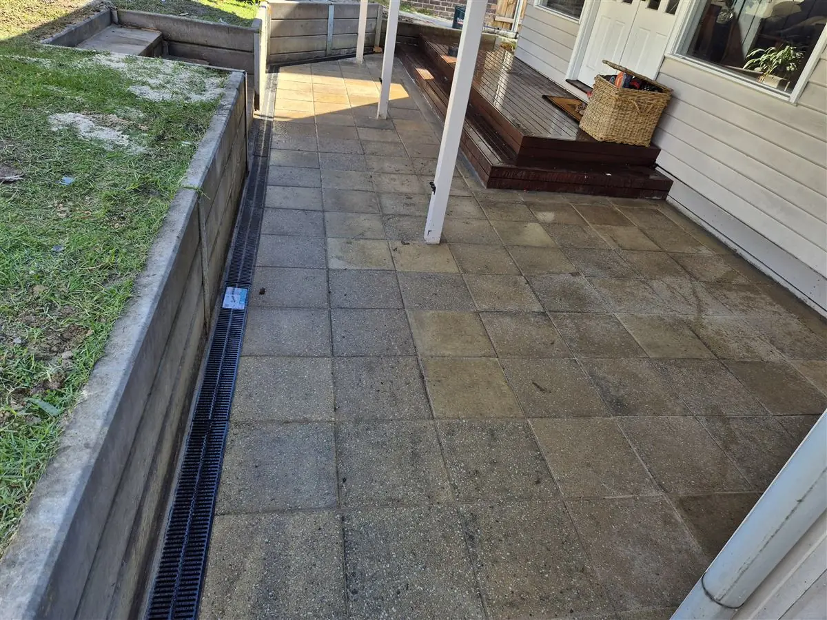 Paved courtyard with drainage channel