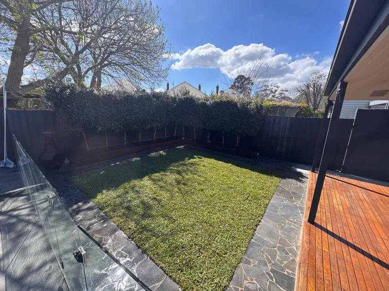 Bluestone crazy paving and new turf — Melbourne by Antonio PrimeScape Construction