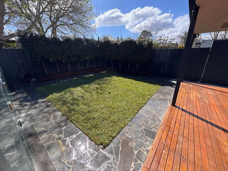 Bluestone crazy paving around a new lawn — Melbourne by Antonio PrimeScape Construction