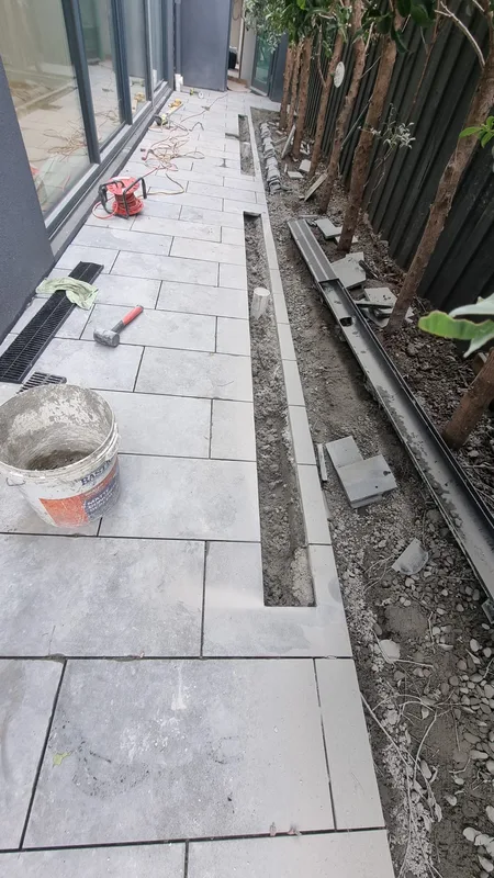 Large-format paving with a strip drain, in progress — Antonio PrimeScape Construction
