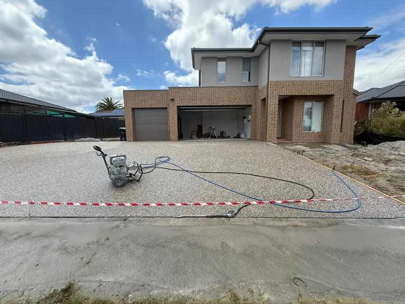 Exposed aggregate driveway, double-storey home