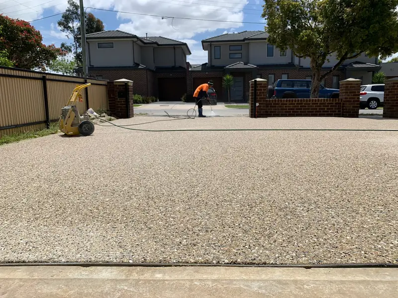 Wide exposed aggregate driveway for townhouses — Antonio PrimeScape Construction
