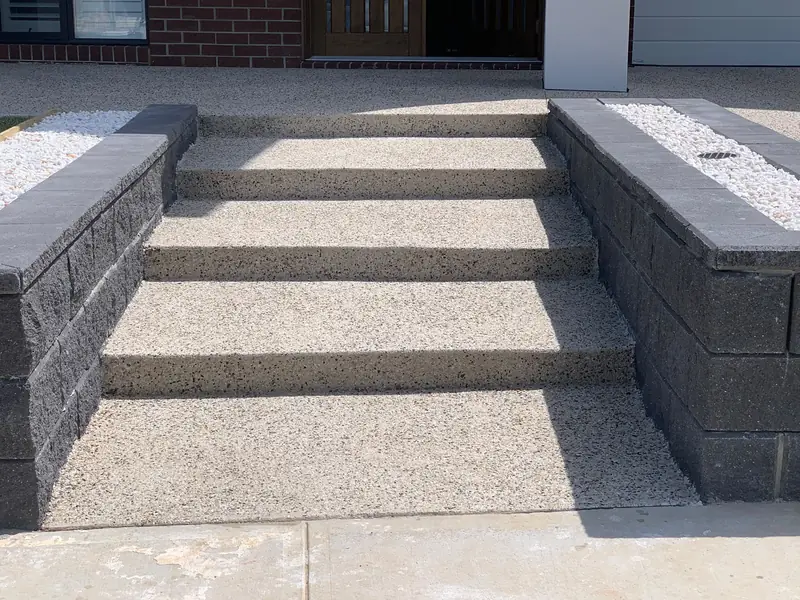 Exposed aggregate steps between block walls