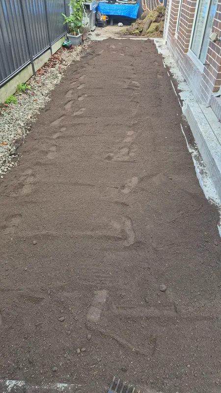 Compacted crushed-rock base before relaying