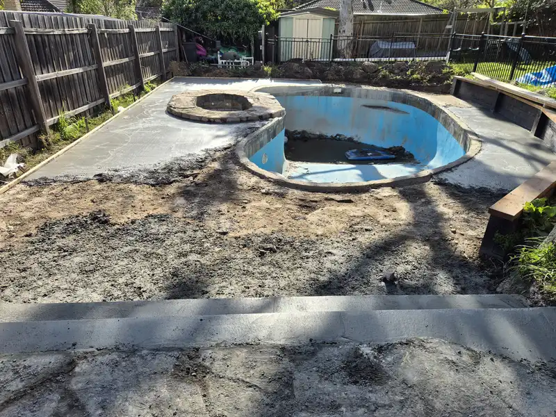 New base prepared around a swimming pool ready for new paving