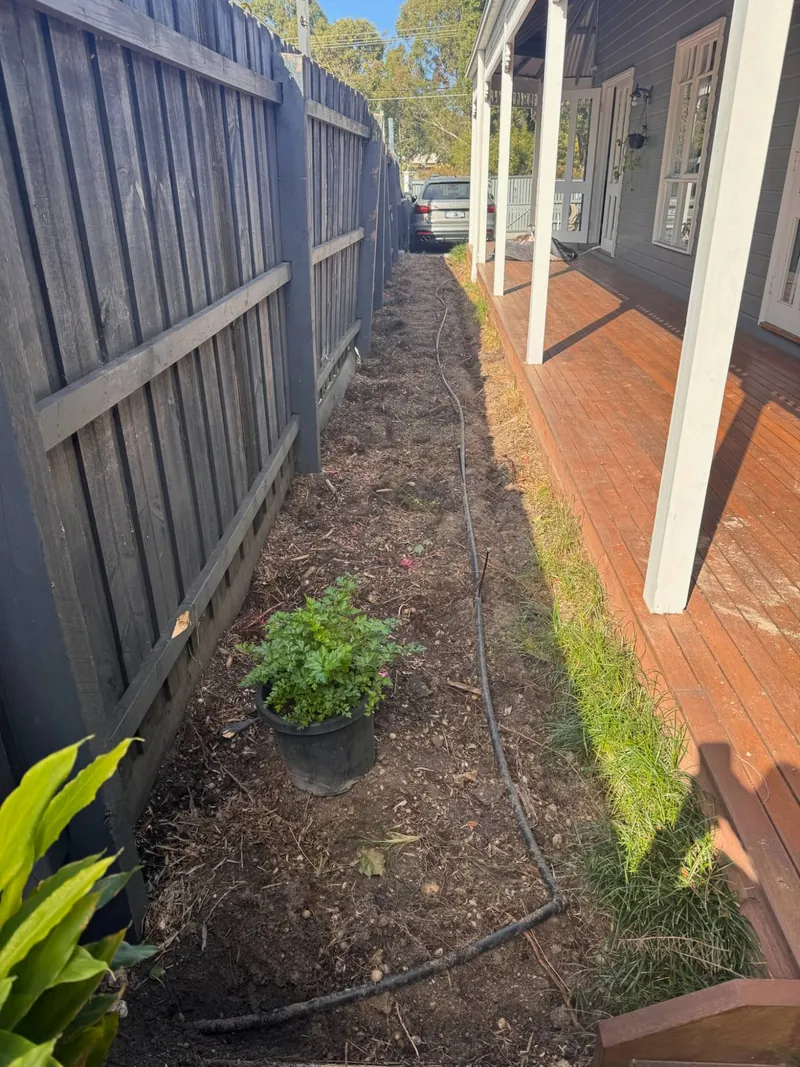 Before: bare side strip by Antonio PrimeScape Construction