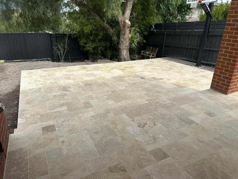 Travertine backyard entertaining area