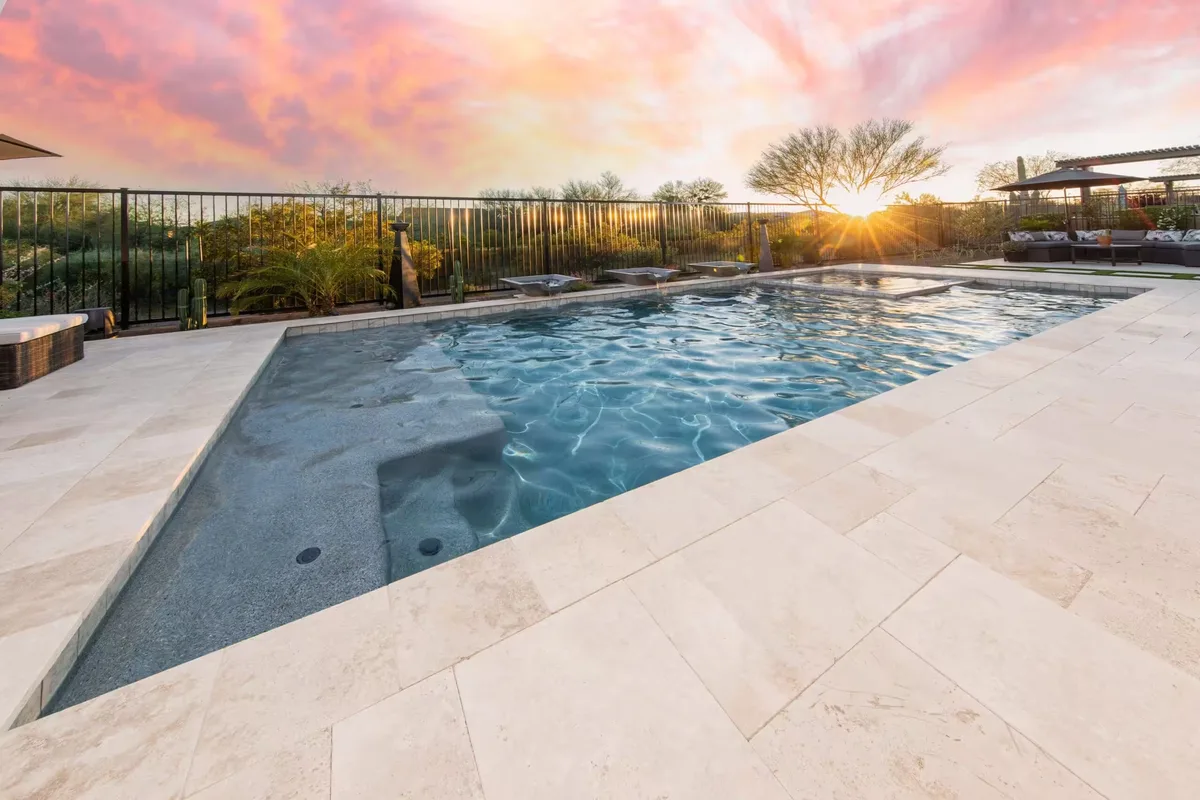 Pool paving travertine surround sunset view Melbourne by Antonio PrimeScape