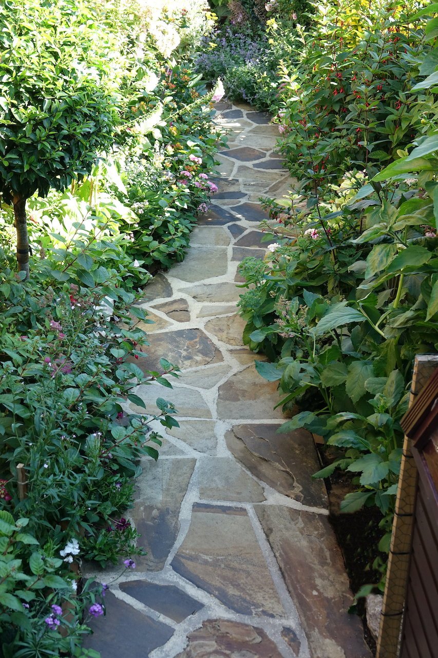 Flagstone crazy paving winding garden path