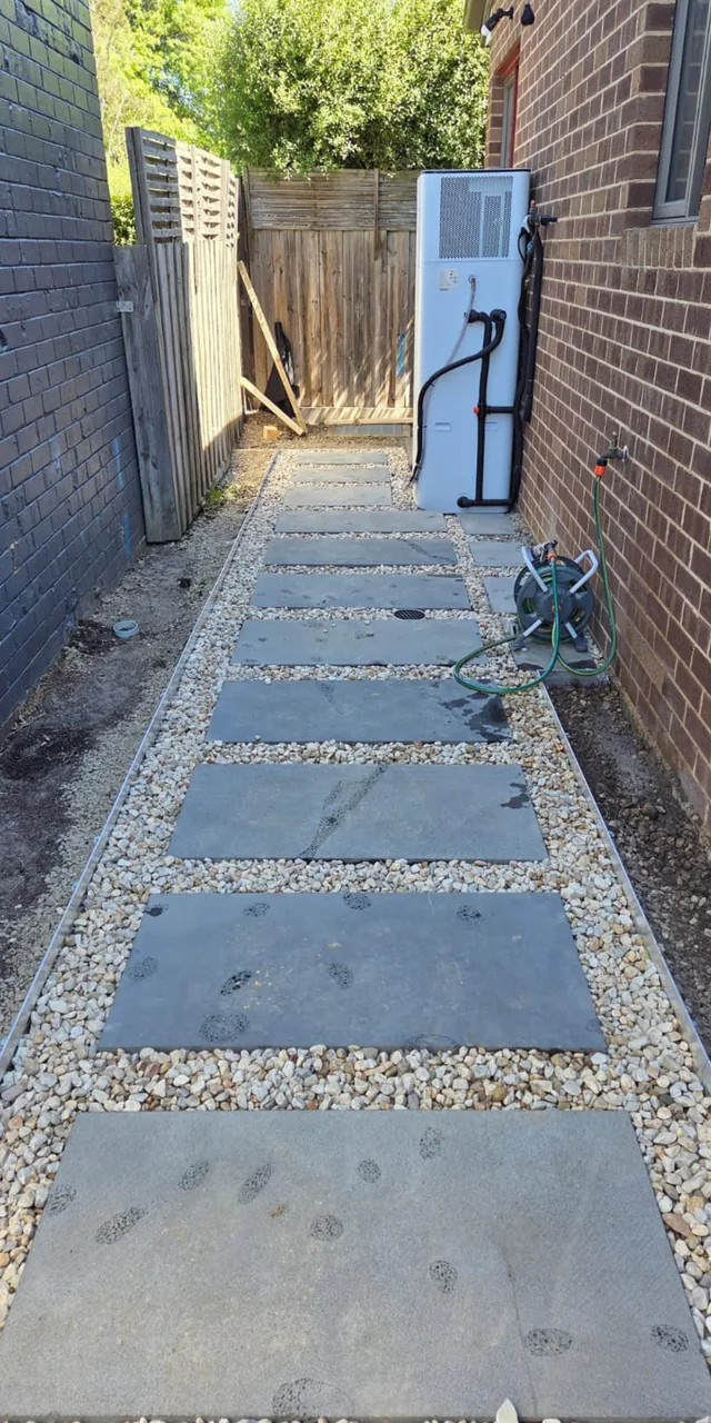 Bluestone stepping-stone path with pebble border — Antonio PrimeScape Construction